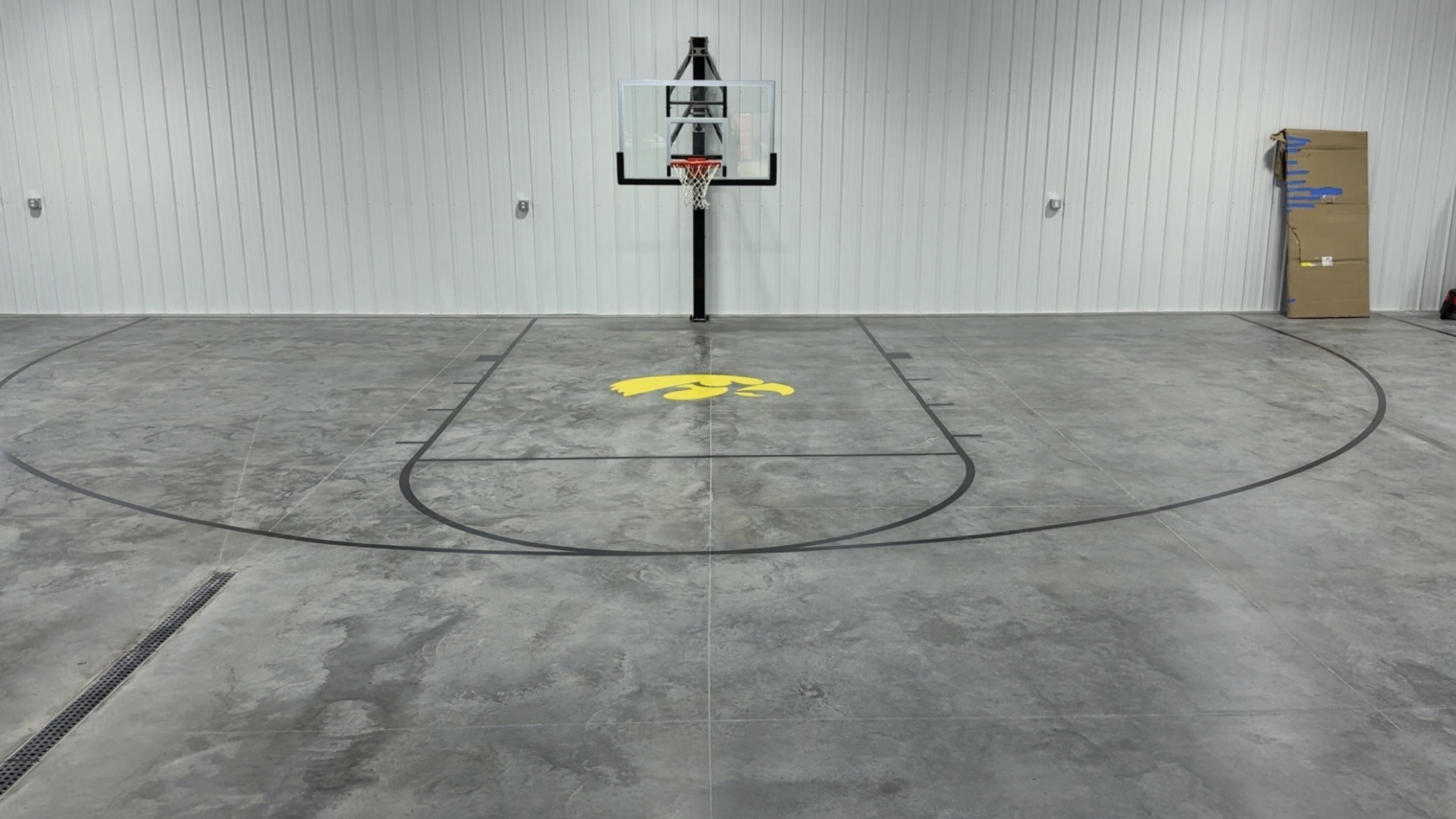 An indoor basketball court finished on a concrete slab by DCS