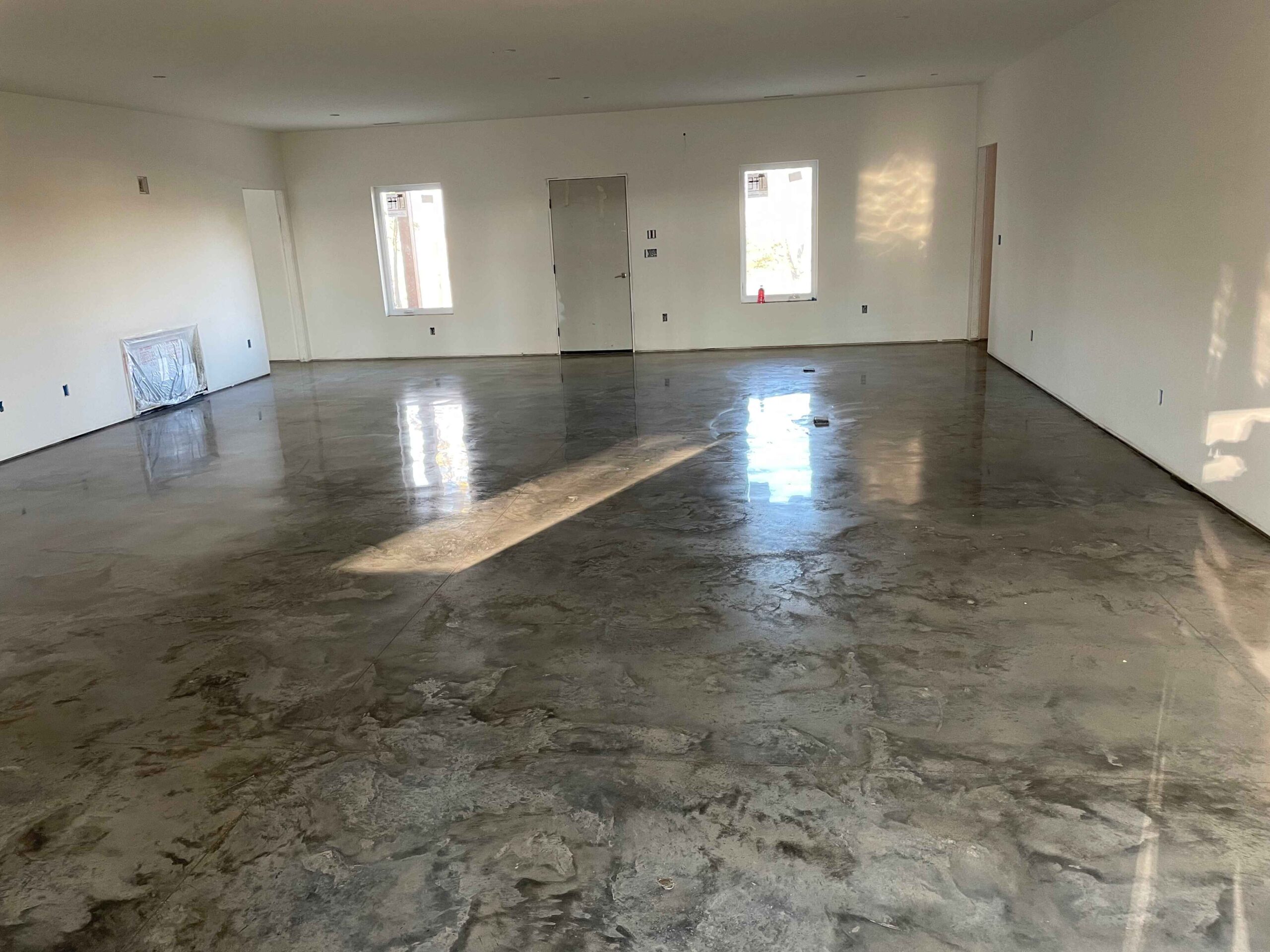 Metallic epoxy floor in a new build home
